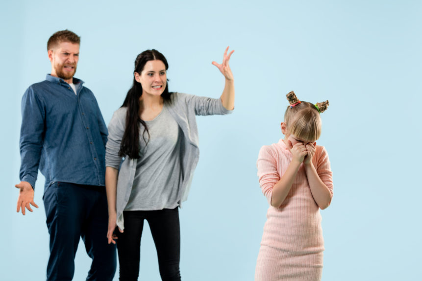 angry-parents-scolding-their-daughter-home angry-parents-scolding-their-daughter-home