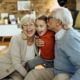 cheerful-grandparents-granddaughter-having-fun-together-home