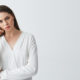 displeased-young-beautiful-businesswoman-thinking-with-finger-near-temple