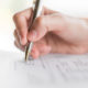 hand-with-pen-application-form