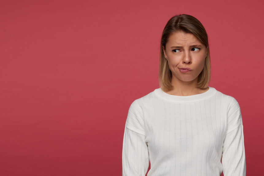 indoor-portrait-young-female-posing-red-background-looks-aside-copy-space-with-confused-irritated-facial-expression indoor-portrait-young-female-posing-red-background-looks-aside-copy-space-with-confused-irritated-facial-expression