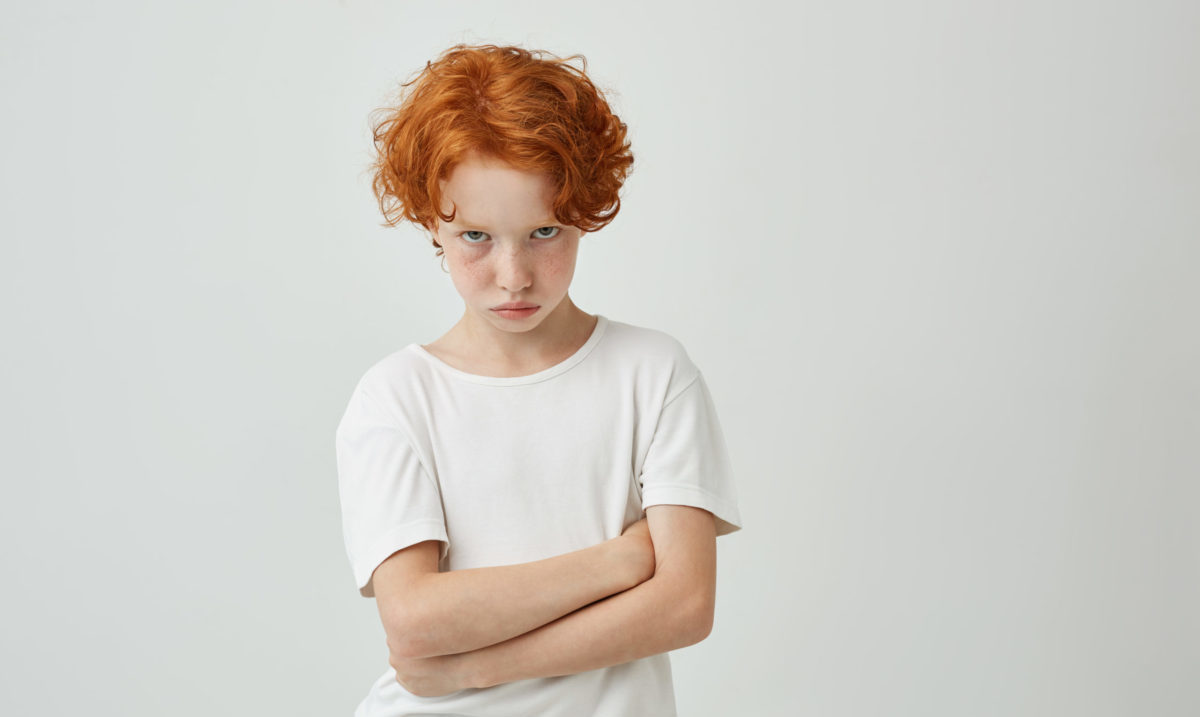 isolated-portrait-unhappy-little-kid-with-red-curly-hair-freckles-being-offended