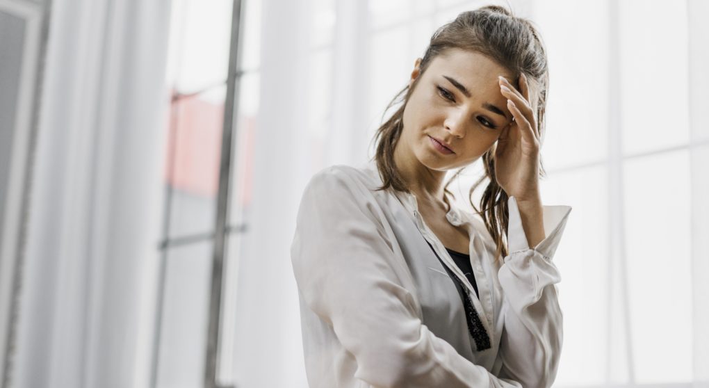 front-view-woman-looking-sad-as-she-worked-from-home-too-much front-view-woman-looking-sad-as-she-worked-from-home-too-much