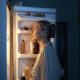 side-view-woman-looking-fridge