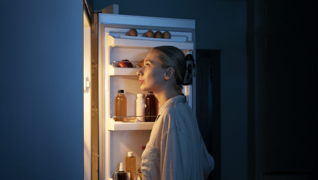 side-view-woman-looking-fridge