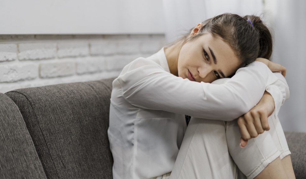 woman-looking-sad-as-she-works-from-home-with-copy-space