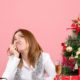 front-view-of-female-worker-sitting-behind-her-table-stressed-dreaming-on-pink_179666-9051