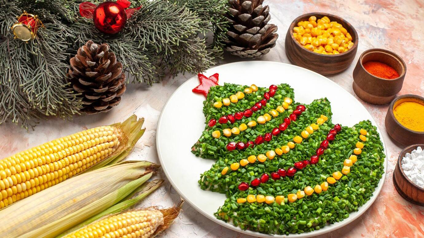 front-view-tasty-green-salad-in-new-year-tree-shape-with-seasonings-on-light-background_140725-132662