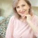 attractive-middle-aged-woman-relaxing-home-sitting-sofa_549566-333