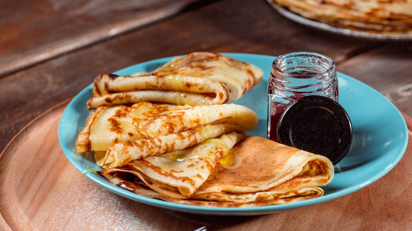fresh-homemade-french-crepes-made-with-eggs-milk-flour-filled-with-marmalade-vintage-plate_155003-6258