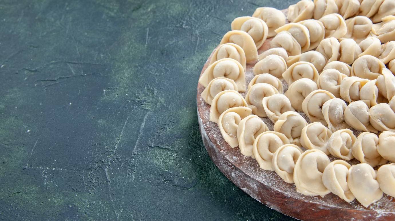 front-view-tasty-little-dumplings-dark-blue-surface_179666-44201