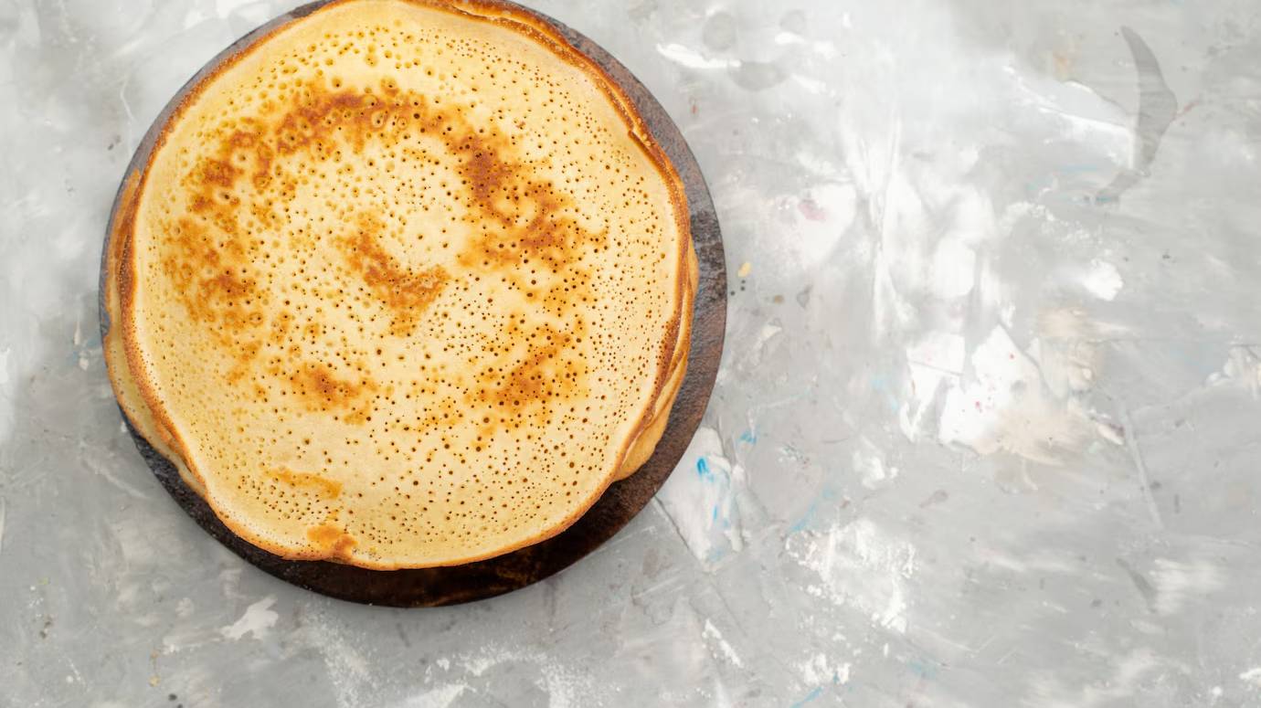top-view-delicious-round-pancakes-yummy-round-formed_140725-22639