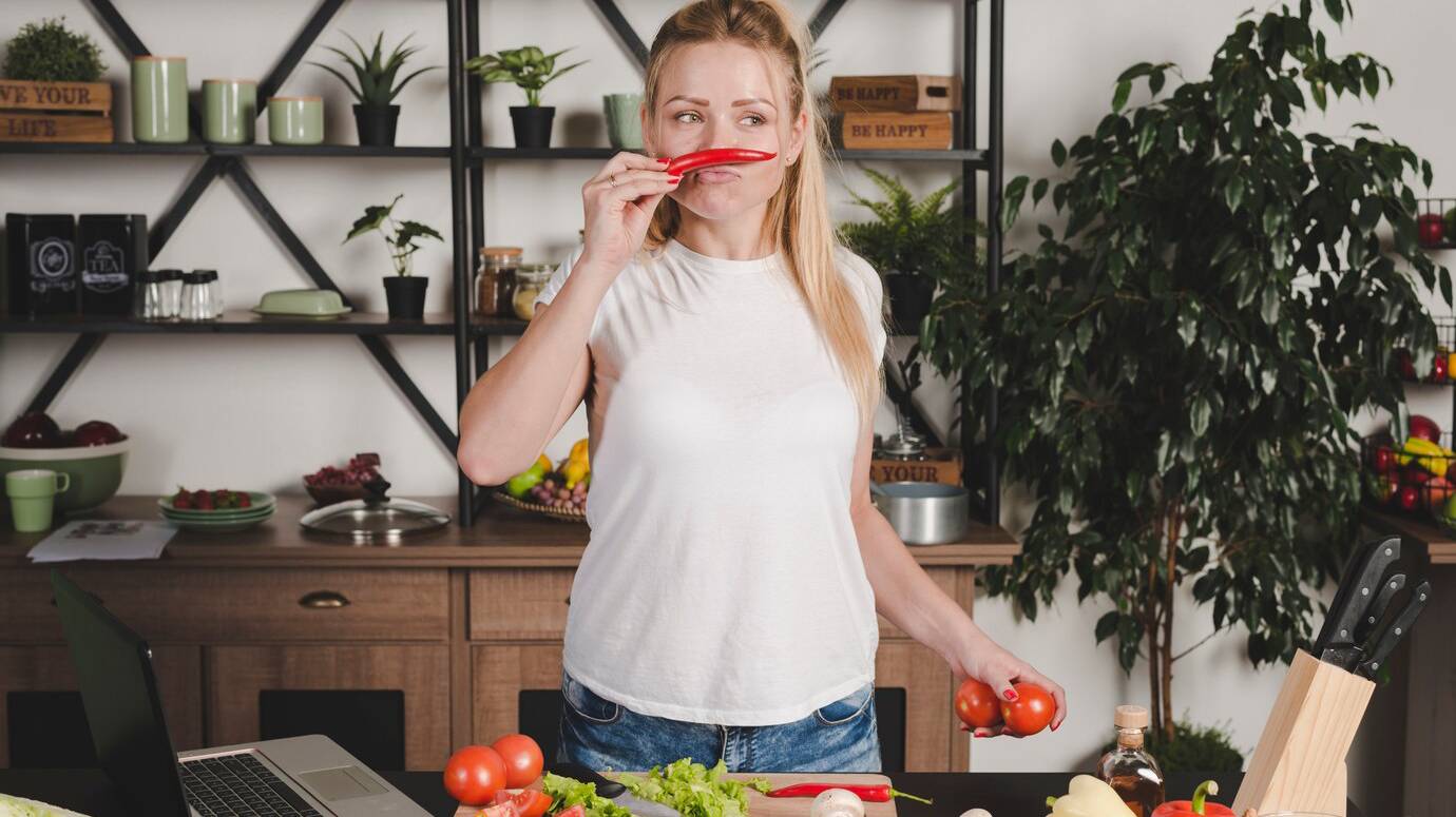 young-woman-standing-kitchen-smelling-red-chili_23-2147917760 young-woman-standing-kitchen-smelling-red-chili_23-2147917760