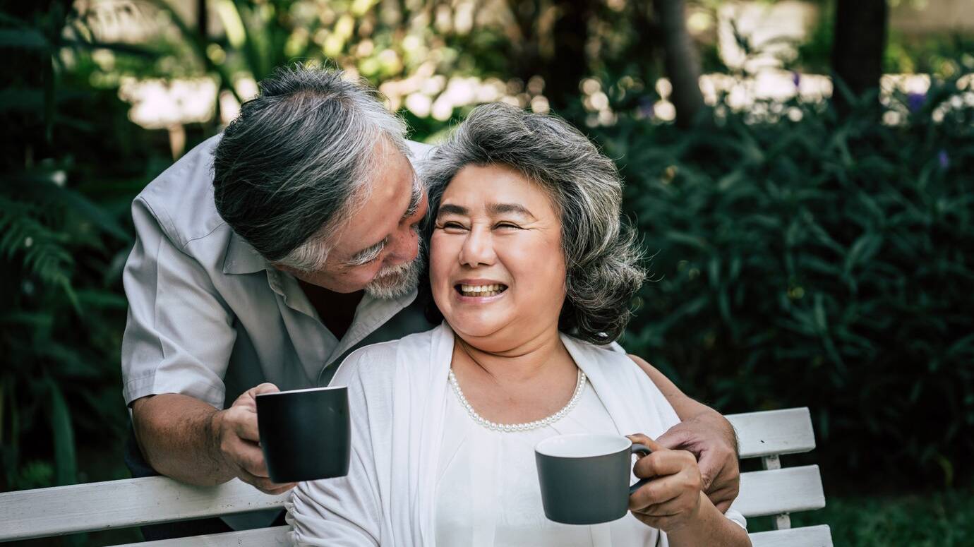elderly-couples-playing-eating-some-fruit_1150-7846