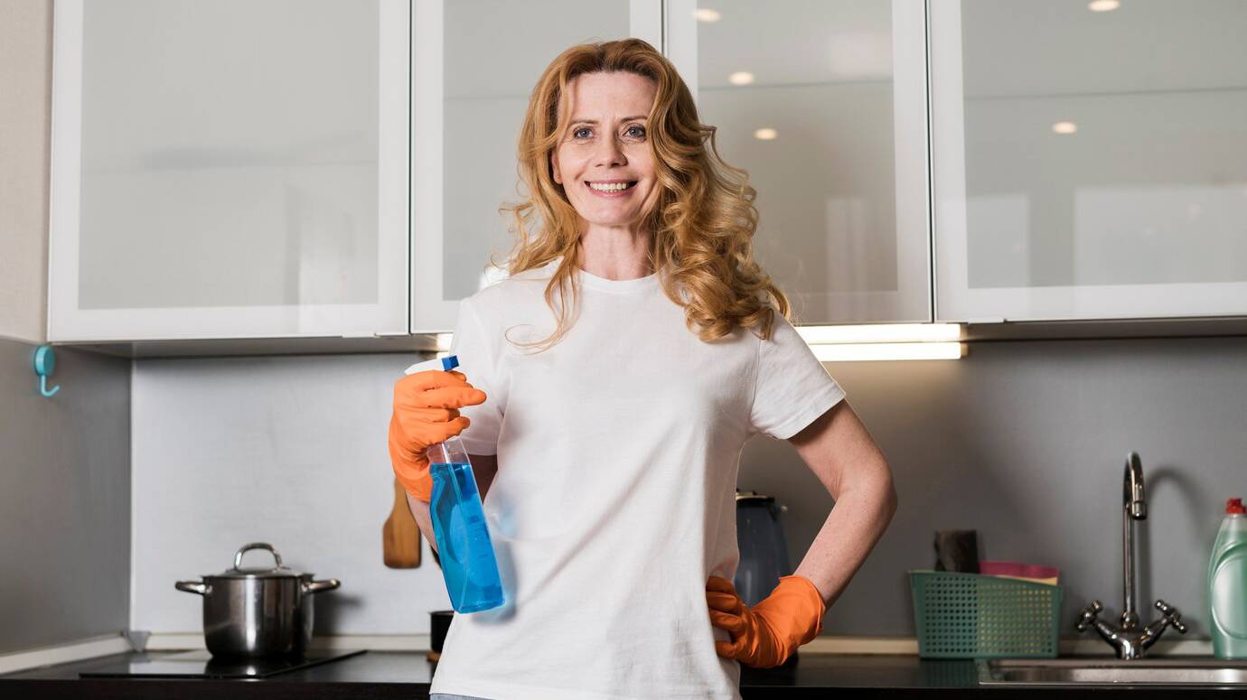 front-view-woman-posing-while-holding-cleaning-product_23-2148465038