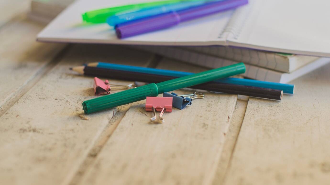 workspace-with-notebooks-pencils_23-2147654397