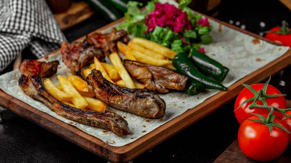 caucasian-barbecue-with-french-fries-lavash-bread_114579-3440