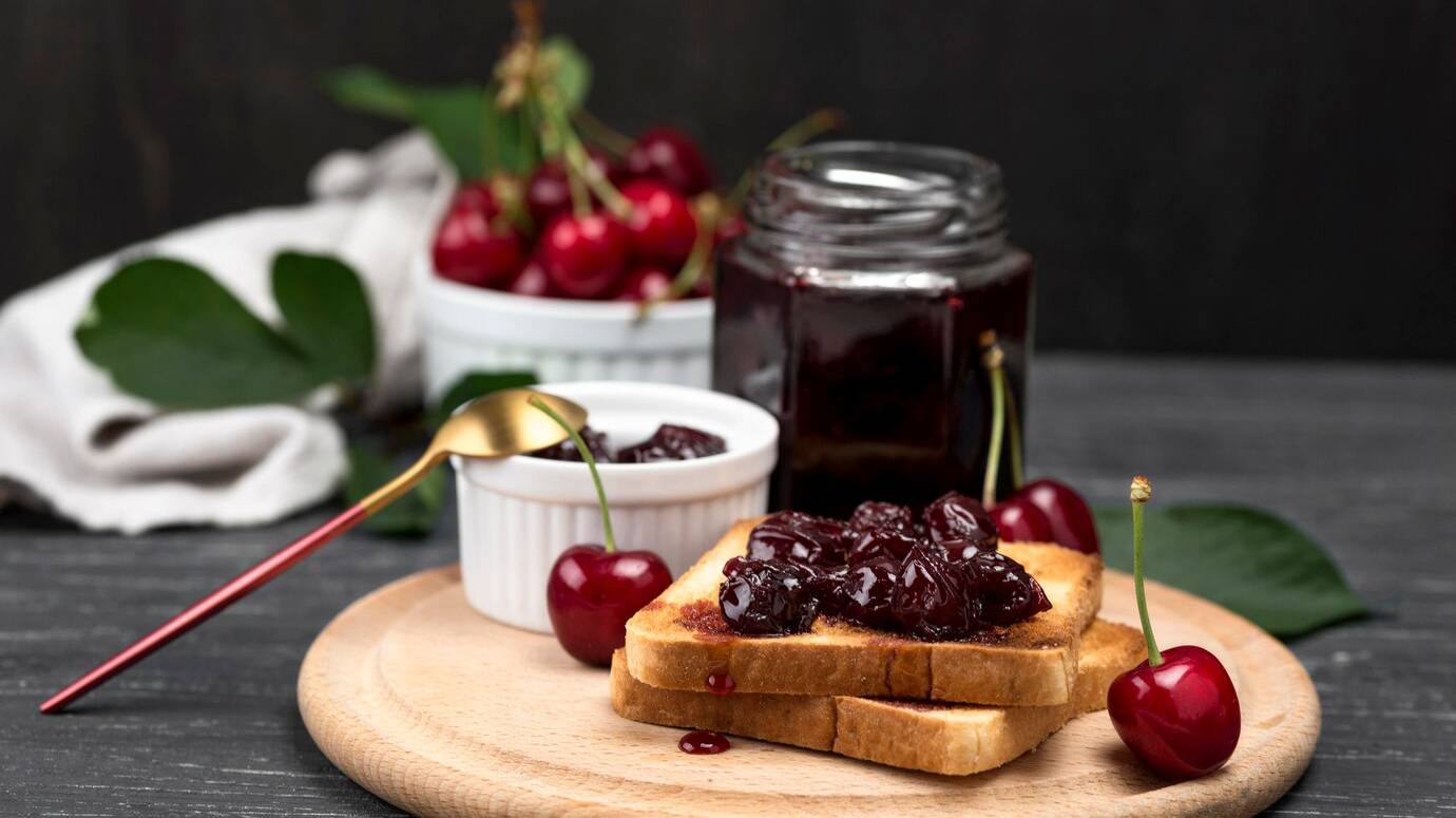 dessert-arrangement-with-cherry-jam_23-2148606848