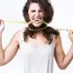 young-woman-biting-tape-measure-white-background_1301-7244