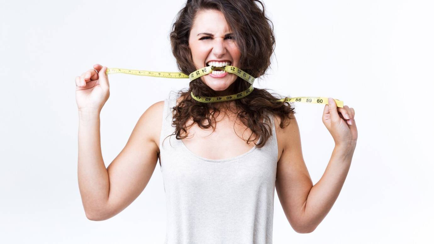 young-woman-biting-tape-measure-white-background_1301-7244 young-woman-biting-tape-measure-white-background_1301-7244