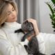 medium-shot-woman-holding-cute-cat_23-2149242553