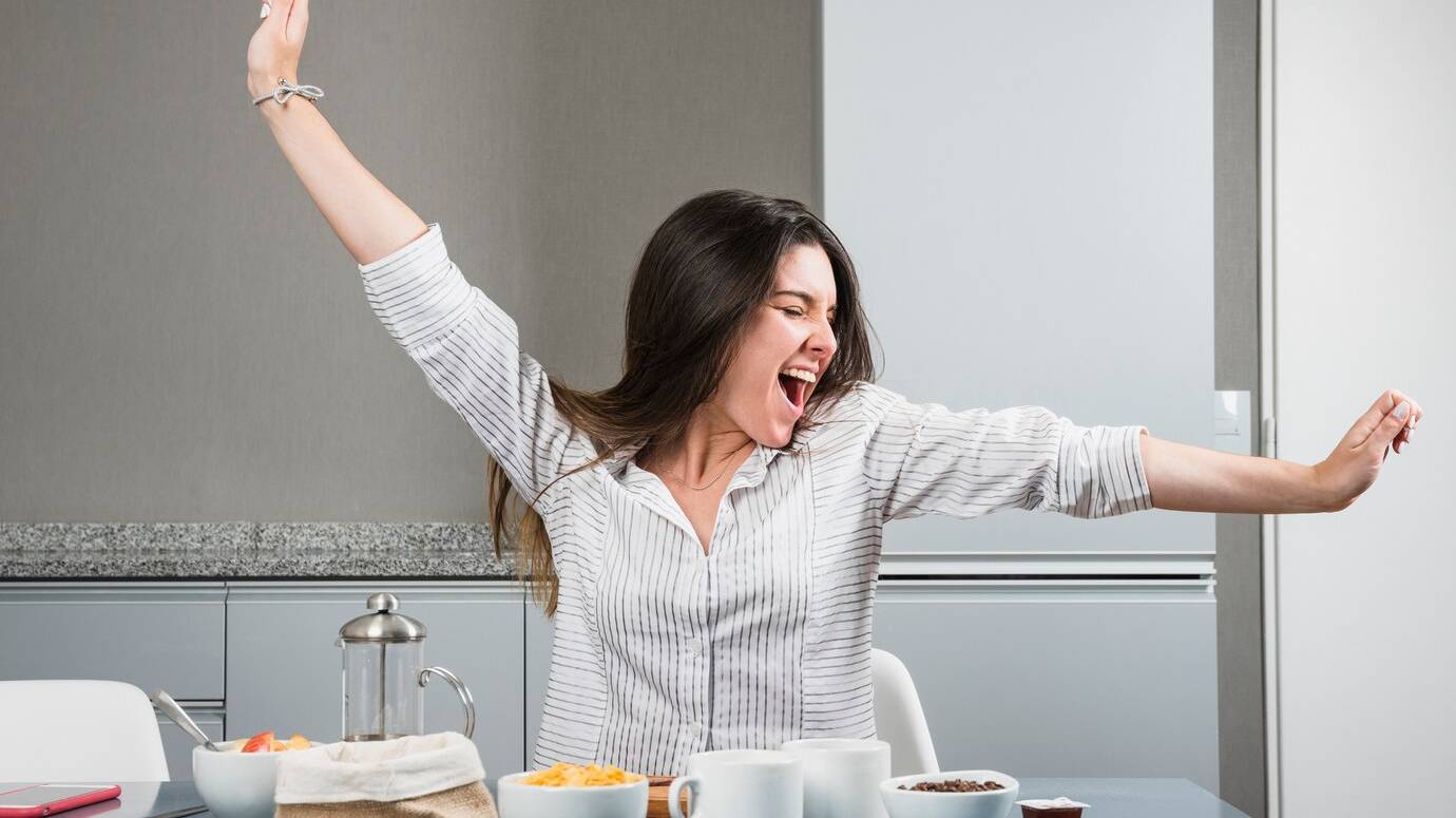 portrait-young-woman-sitting-breakfast-table-stretching-her-arms_23-2148161222 portrait-young-woman-sitting-breakfast-table-stretching-her-arms_23-2148161222