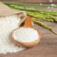 sack-rice-with-rice-wooden-spoon-rice-plant_1150-34312