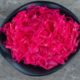 top-view-pink-sauerkraut-black-bowl_114579-82958