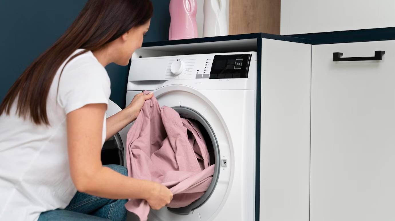 woman-taking-clothes-from-washing-machine_23-2149117037 woman-taking-clothes-from-washing-machine_23-2149117037