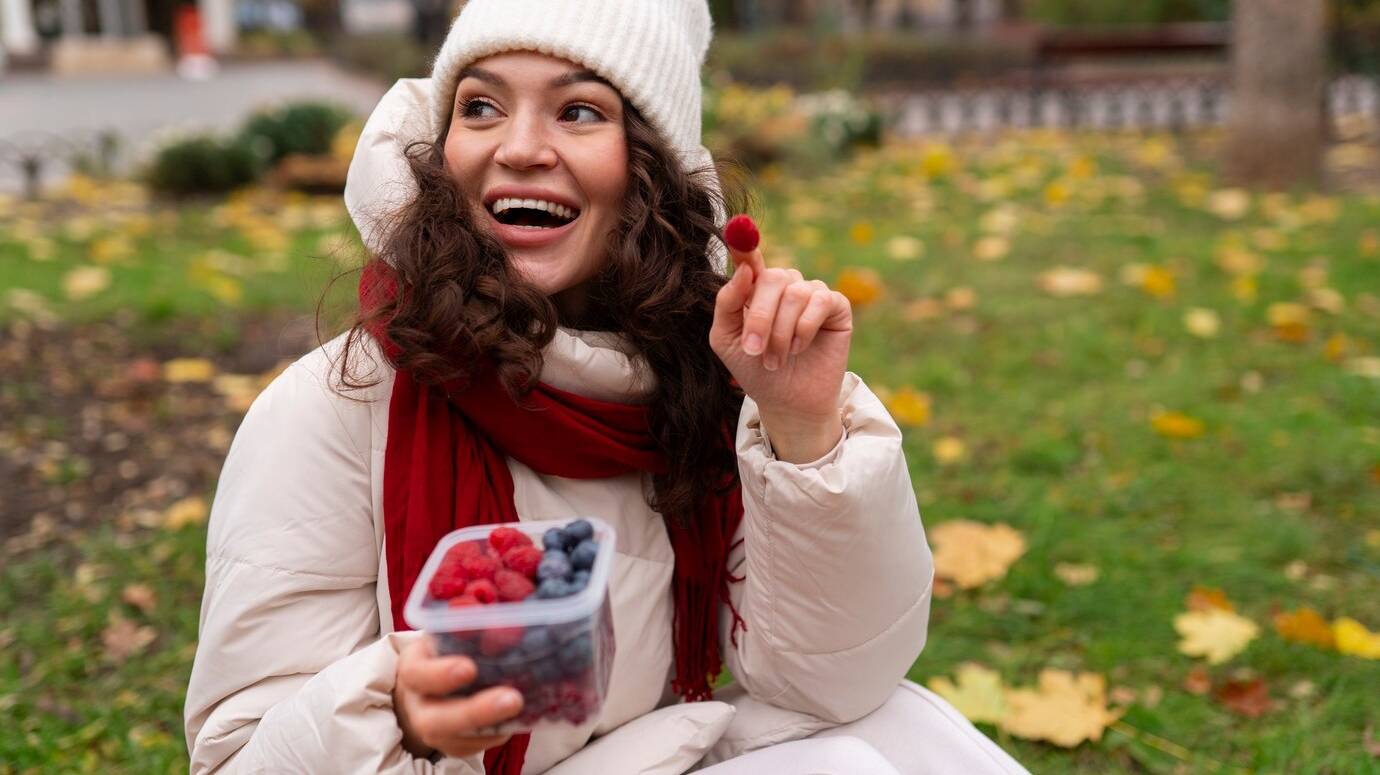 front-view-woman-eating-berries_23-2150062951 front-view-woman-eating-berries_23-2150062951