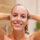 happy-woman-washing-hair-shower_329181-1509