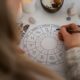 high-angle-woman-reading-tarot-home_23-2150276062