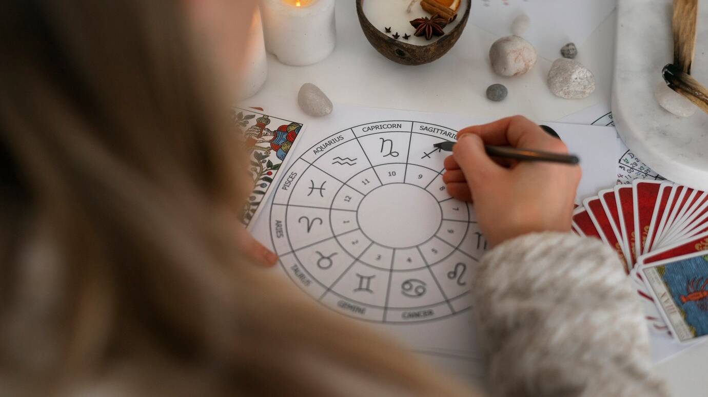 high-angle-woman-reading-tarot-home_23-2150276062 high-angle-woman-reading-tarot-home_23-2150276062