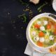 italian-meatball-soup-stelline-pasta-bowl-black-table_2829-4648