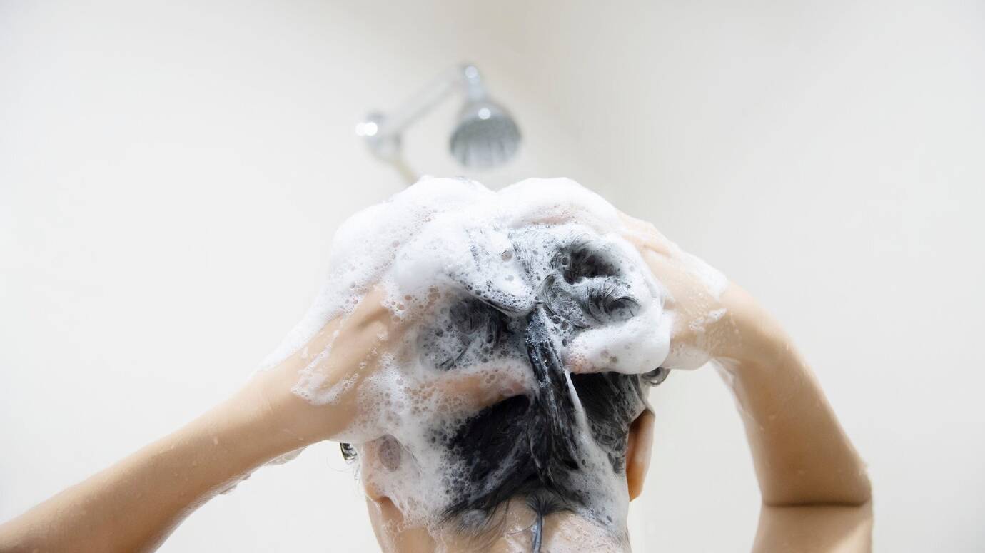 lady-using-shampoo-wash-clean-her-hair-bathroom-with-splash-shower-spray-water_1150-6611