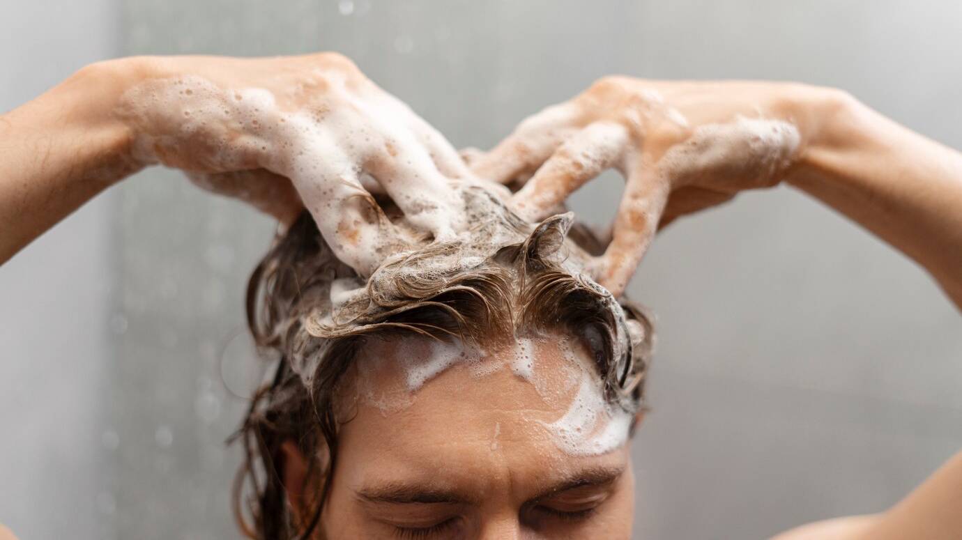 man-giving-himself-scalp-massage_23-2151307416