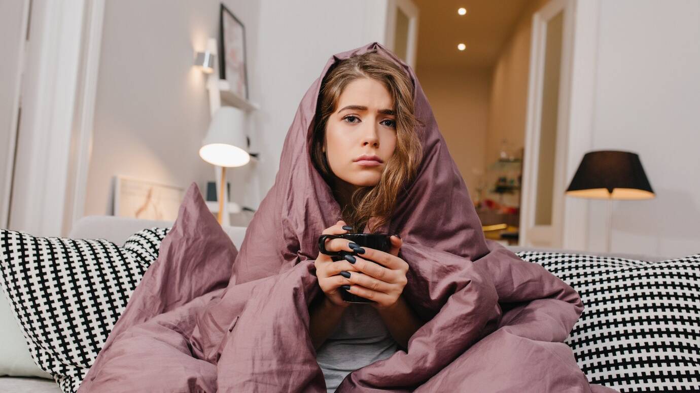 sad-woman-with-beautiful-eyes-drinking-hot-coffee-cold-morning_197531-6606