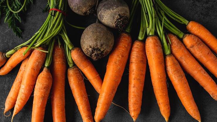 top-view-arrangement-carrots_23-2148758836