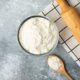 bowl-flour-eggs-kitchen-tools-marble-surface_114579-31420