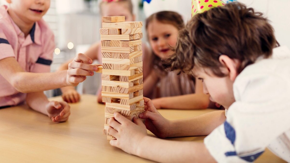 children-colored-caps-playing-game_23-2147807819