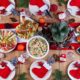 christmas-table-is-served-with-appetizer-decorated-with-bright-tinsel-candles-table-setting-christmas-dinner-flat-lay-top-view_2829-20297