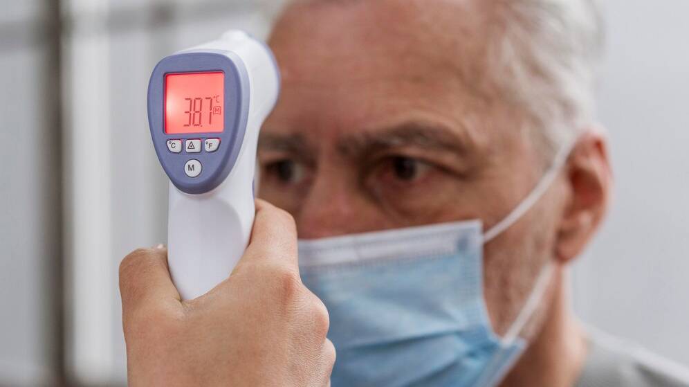 patient-having-his-temperature-checked_23-2148813433