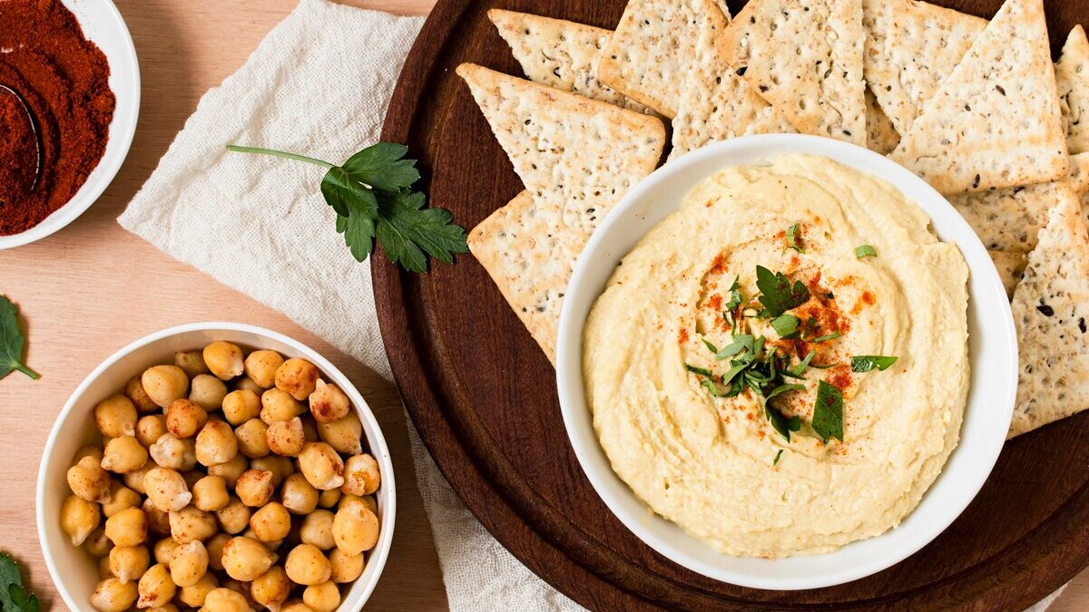 top-view-nacho-chips-with-hummus-ketchup_23-2148562792 (1)