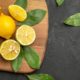 top-view-fresh-lemons-sour-fruits-dark-table-citrus-fruit_140725-81409